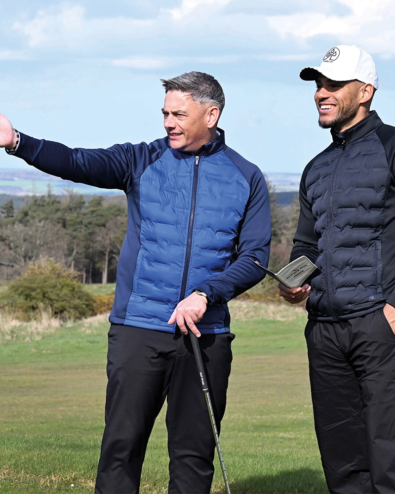 Two players in Vortex looking across golf course
